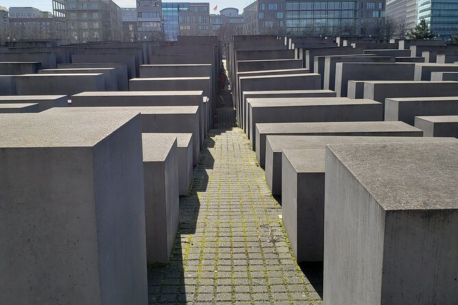 Berlin: Private Highlights Walking Tour with Local Guide and Hotel pickup - Stop 3: Checkpoint Charlie and the Reality of the Border