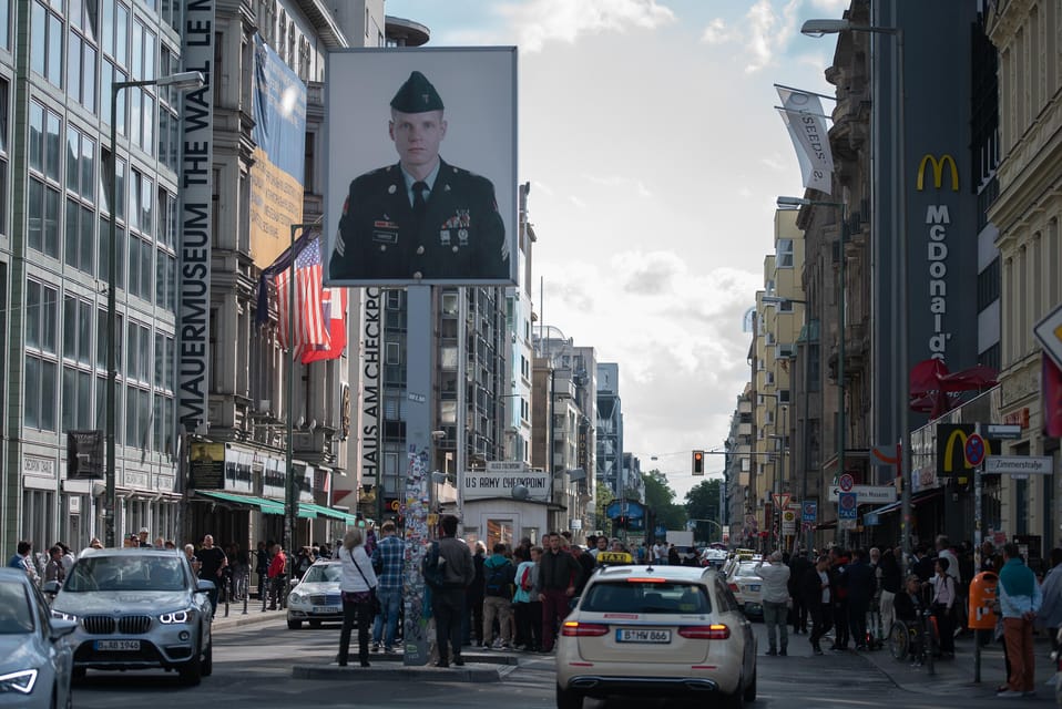 Private Highlights of Berlin Bike Tour - Checkpoint Charlie and the Berlin Wall Remnant You Can Still Read